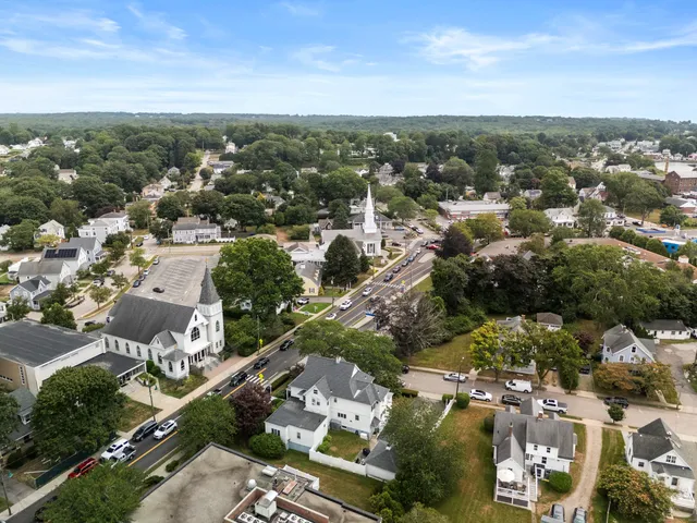 an aerial view of residential houses with city view