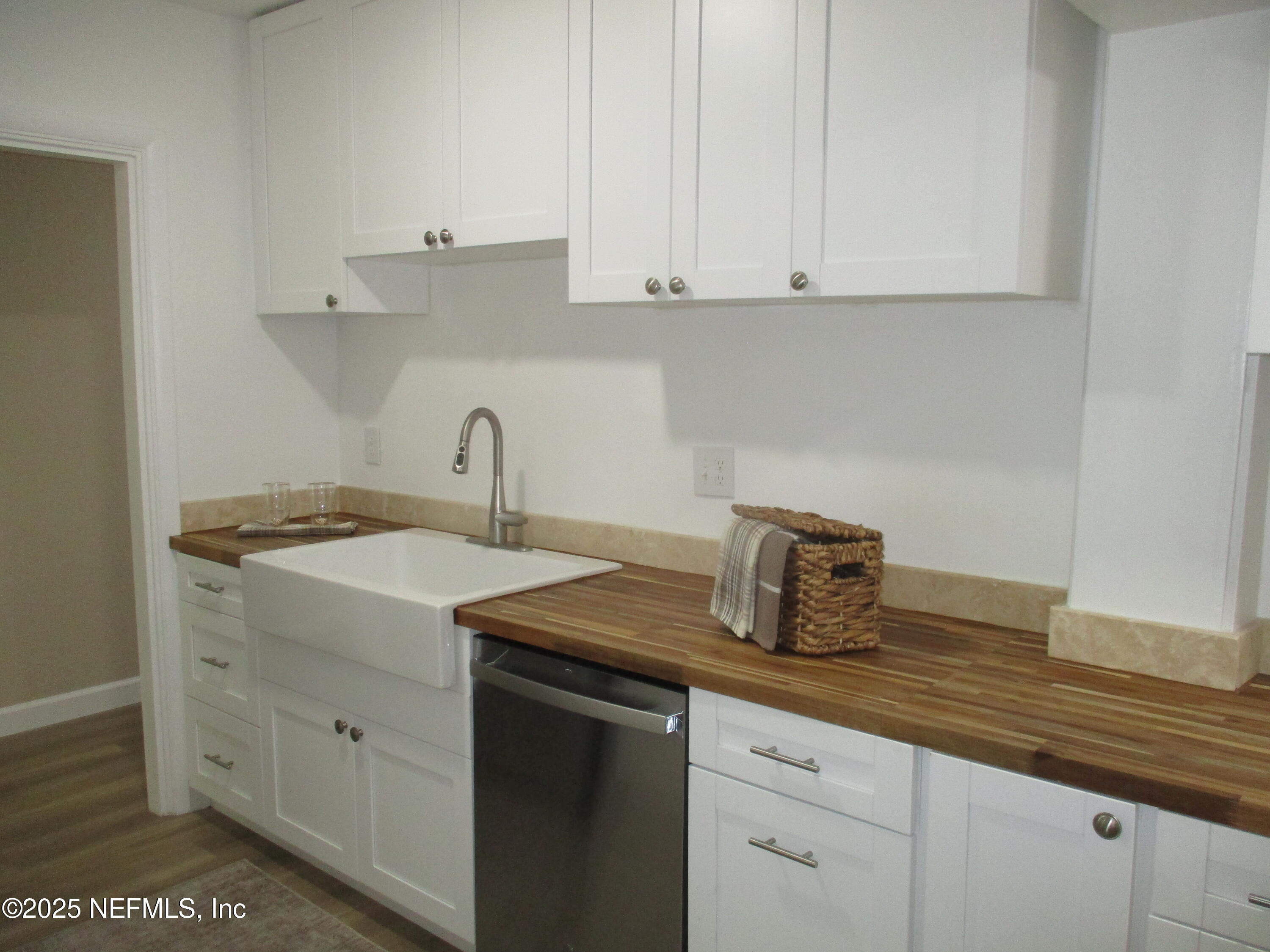 6114 Stetson Road Jacksonville, FL 32217 - Photo 6 of 23 a kitchen with a sink and cabinets
