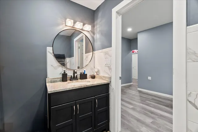 a bathroom with a sink and a mirror