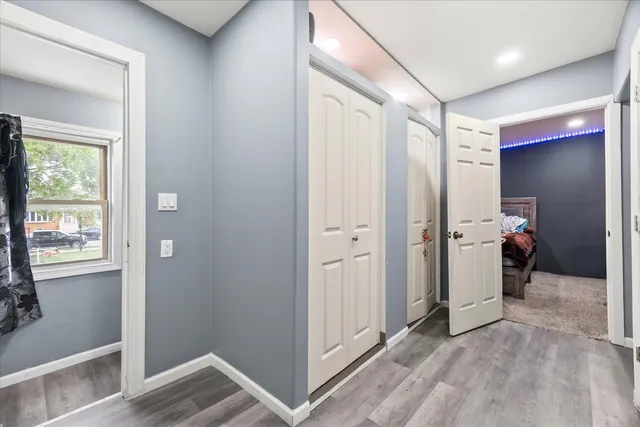 a view of hallway with a large window and entryway
