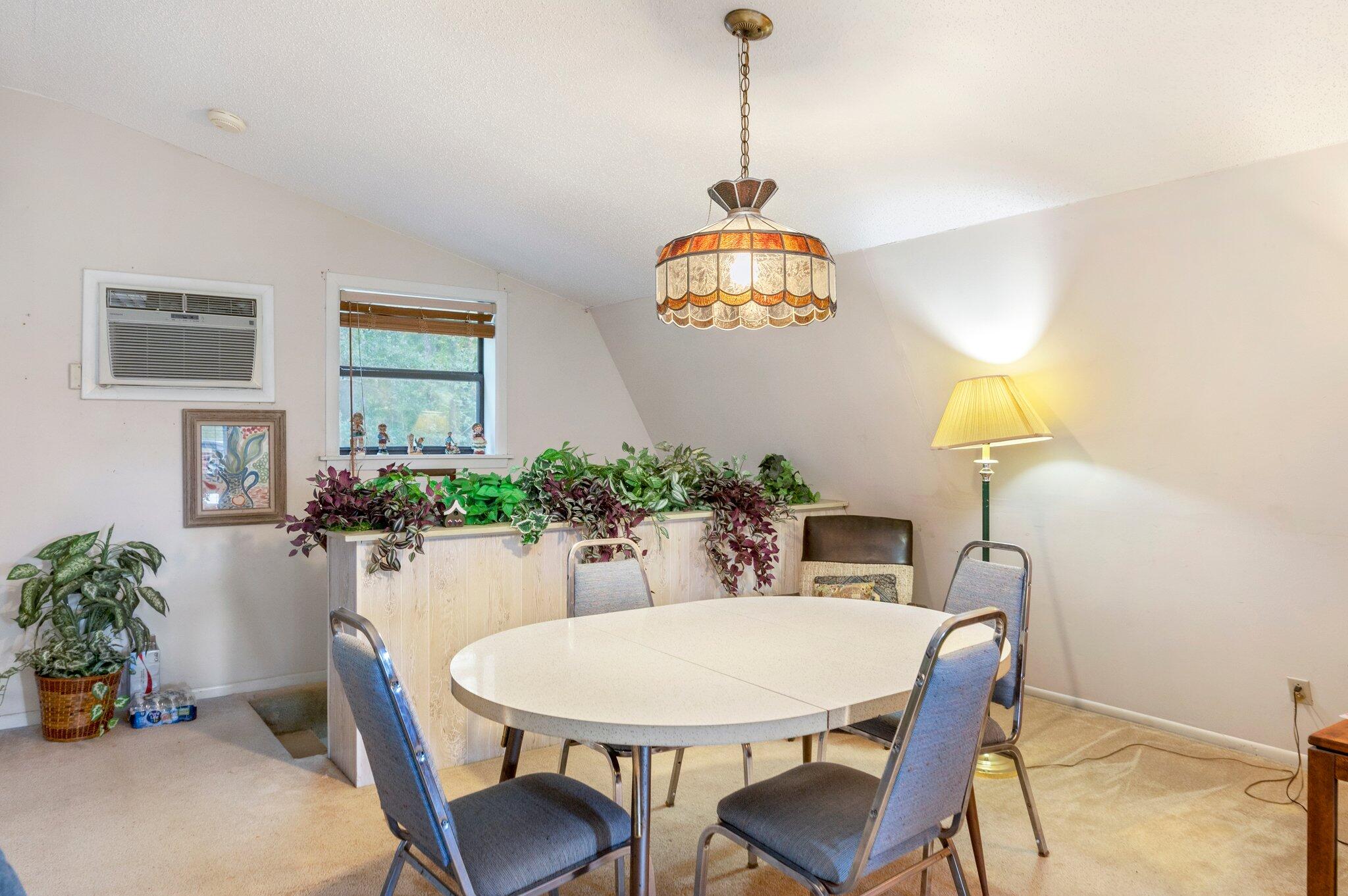 410 Kilpatrick Road Florala, AL 36442 - Photo 6 of 60 a view of a dining room with furniture and wooden floor