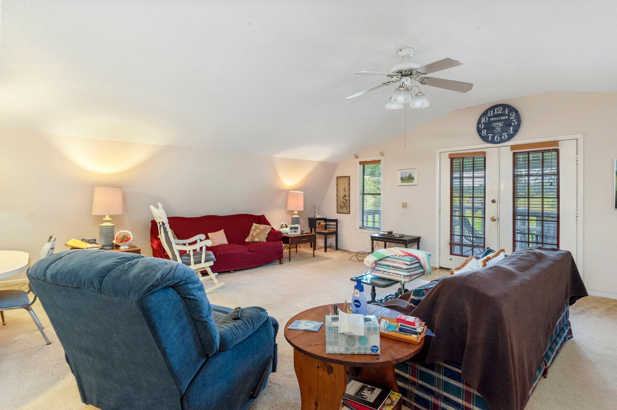 410 Kilpatrick Road Florala, AL 36442 - Photo 7 of 60 a living room with furniture a large window and a chandelier