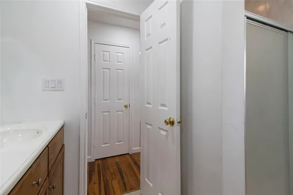 a bathroom with a shower and a sink
