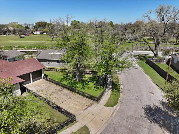 a view of a garden with an outdoor seating