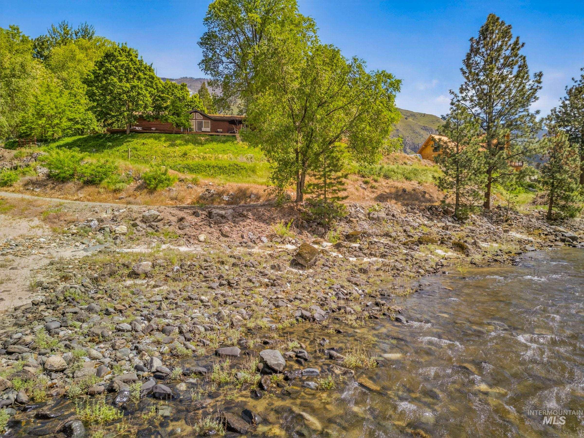 151 Cow Creek Road Lucile, ID 83542 - Photo 46 of 50 Riverfront property featuring a visible river and a rocky shoreline