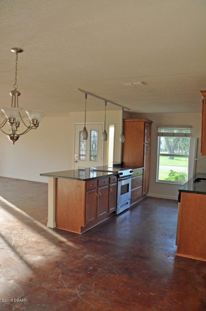 1016 South Riverside Drive Edgewater, FL 32132 - Photo 8 of 13 Kitchen & Dining Area