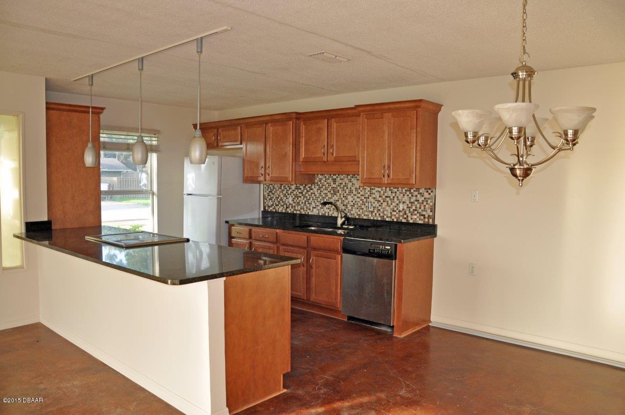 1016 South Riverside Drive Edgewater, FL 32132 - Photo 9 of 13 Kitchen & Dining Area
