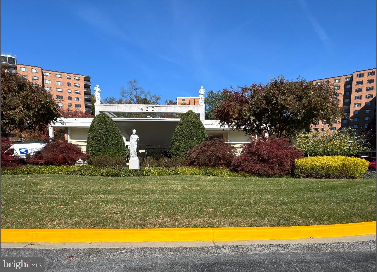 4201 Cathedral Avenue Northwest, Unit 1219E Washington, DC 20016 - Photo 13 of 20 a view of a swimming pool and a yard
