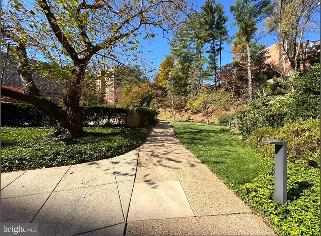 a swimming pool with outdoor seating and yard