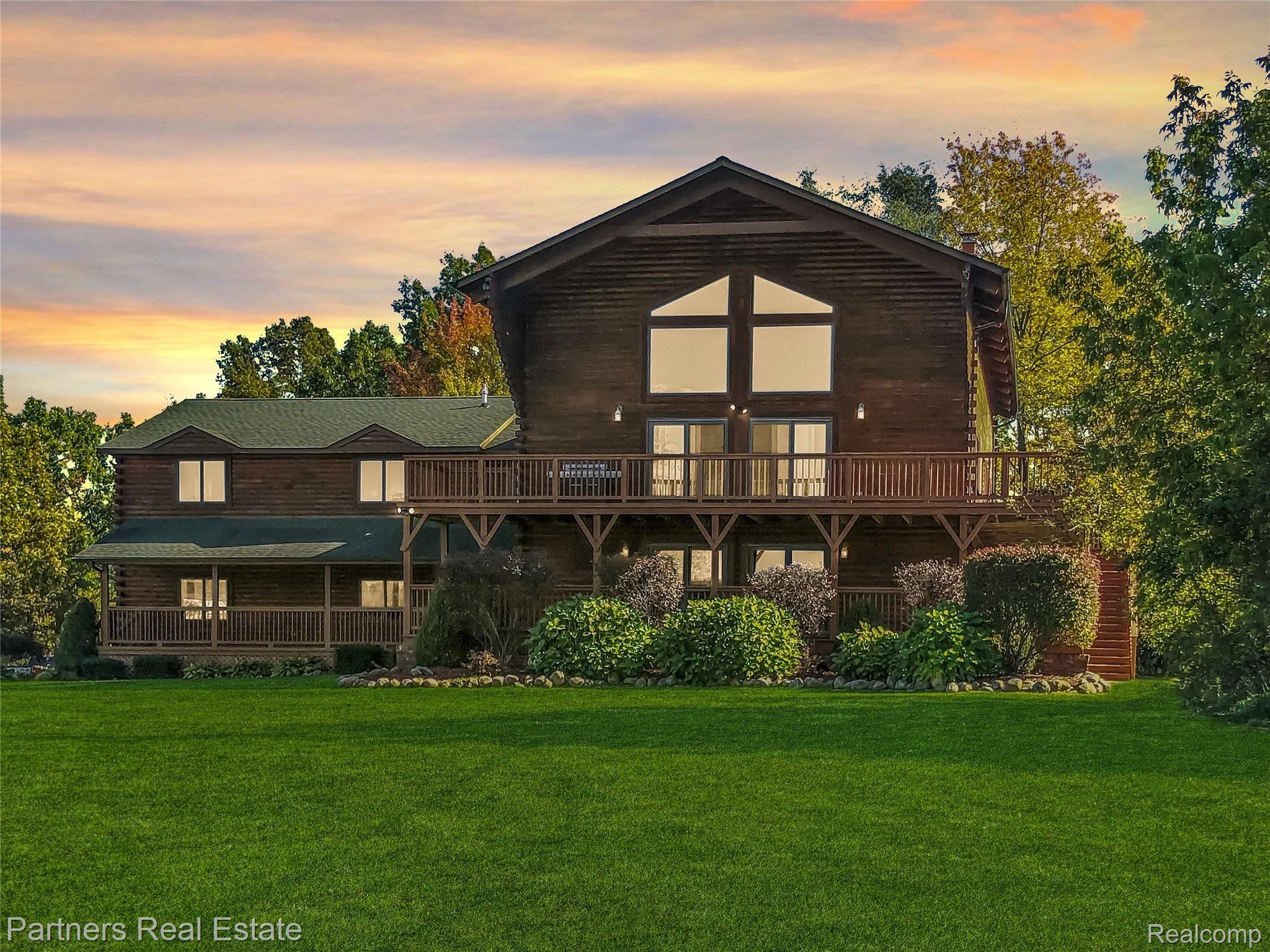 3350 Cullen Road Howell, MI 48855 - Photo 1 of 50 1. Cullen Rd Log Home at Dusk