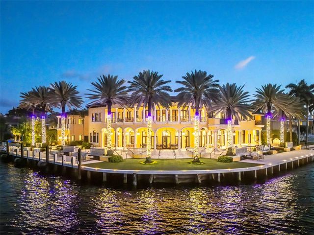 an aerial view of a swimming pool with outdoor seating