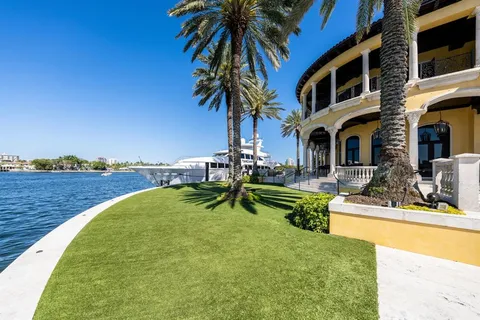 a large kitchen with granite countertop a sink and a stove