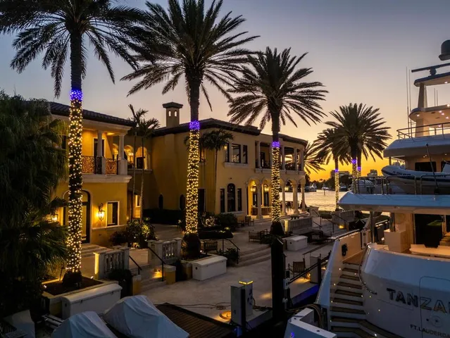 an aerial view of a house with a lake view
