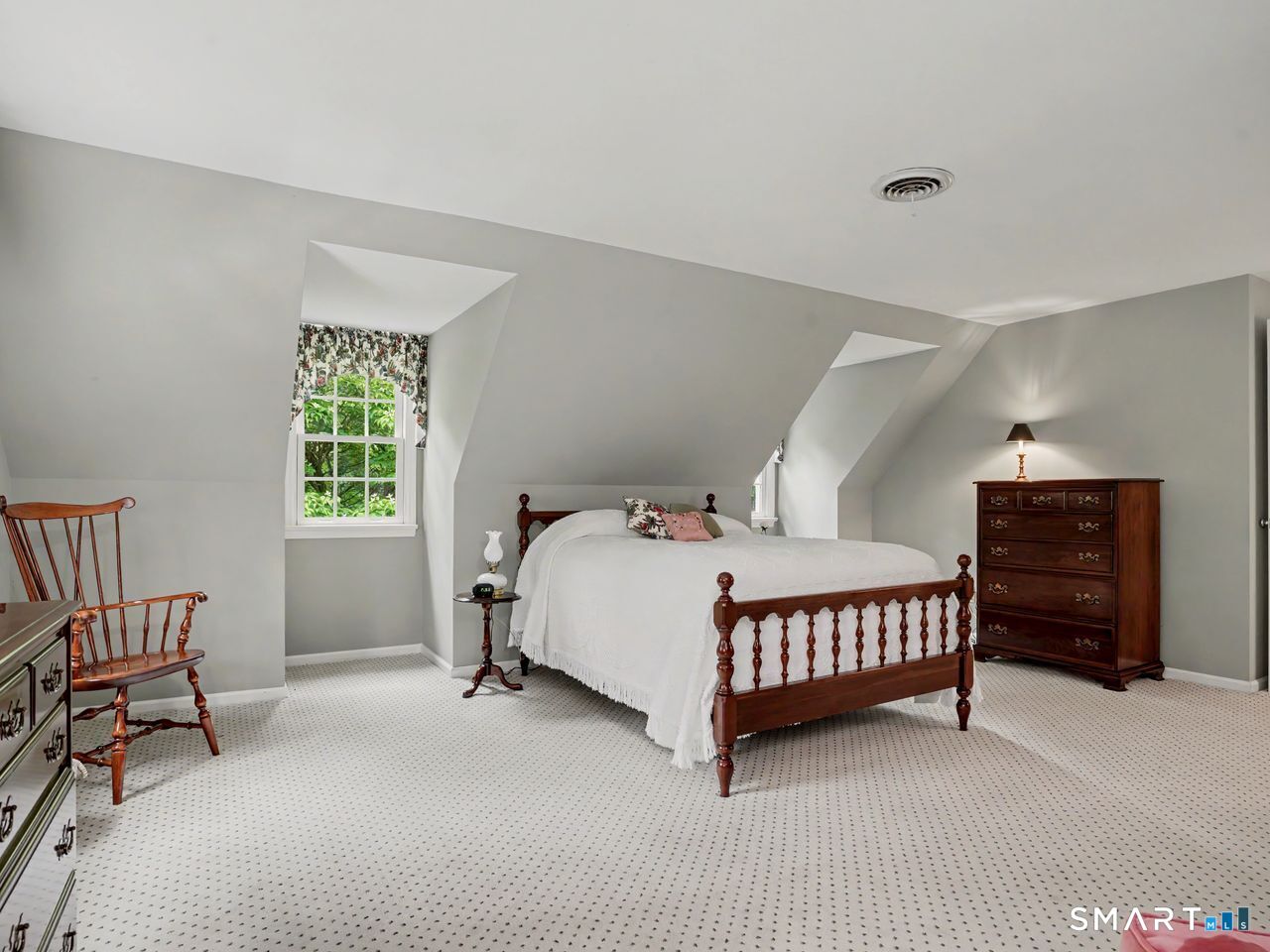 86 Fire Hill Road Redding, CT 06896 - Photo 22 of 36 a bed room with a bed and a chair
