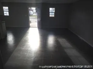 a view of an empty room and window