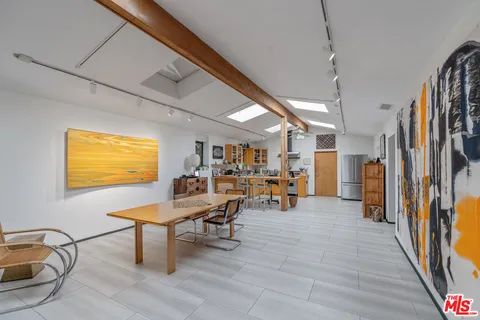 a view of a livingroom with furniture and lounge chair