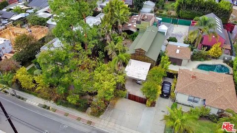 an aerial view of residential house with outdoor space and street view