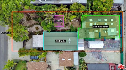 an aerial view of a house with a garden