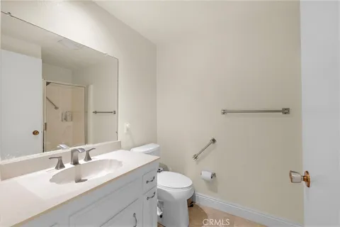 a bathroom with a sink toilet and vanity