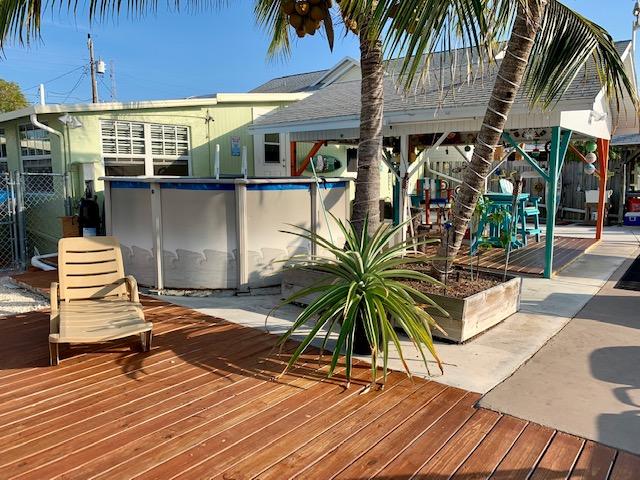 228 Upper Matecumbe Road Key Largo, FL 33037 - Photo 9 of 68 Sun Bathing area next to pool, dock and