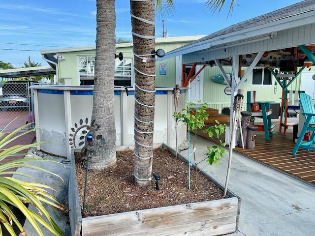 228 Upper Matecumbe Road Key Largo, FL 33037 - Photo 10 of 68 Sun Bathing area next to pool, dock and