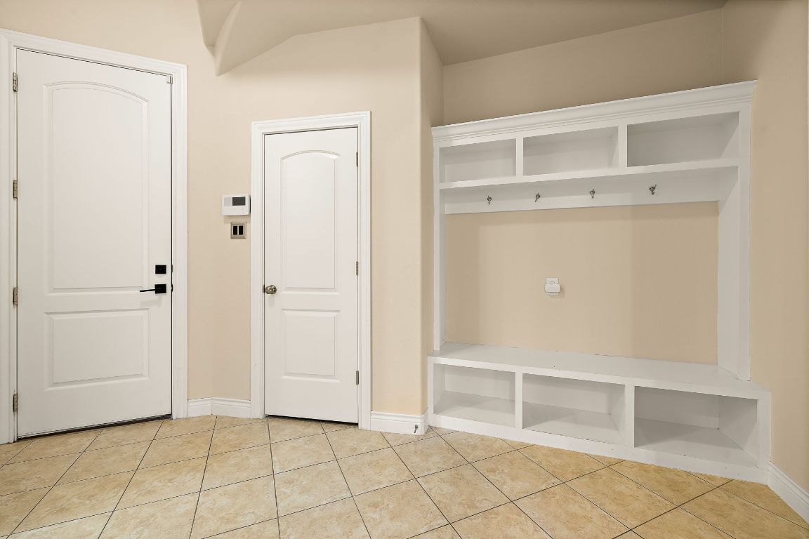 174 Estrella Crossing Georgetown, TX 78628 - Photo 32 of 39 Mudroom with light tile patterned floors