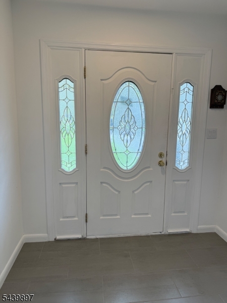 22 Karen Road Vernon, NJ 07422 - Photo 4 of 26 an empty room with window and a mirror