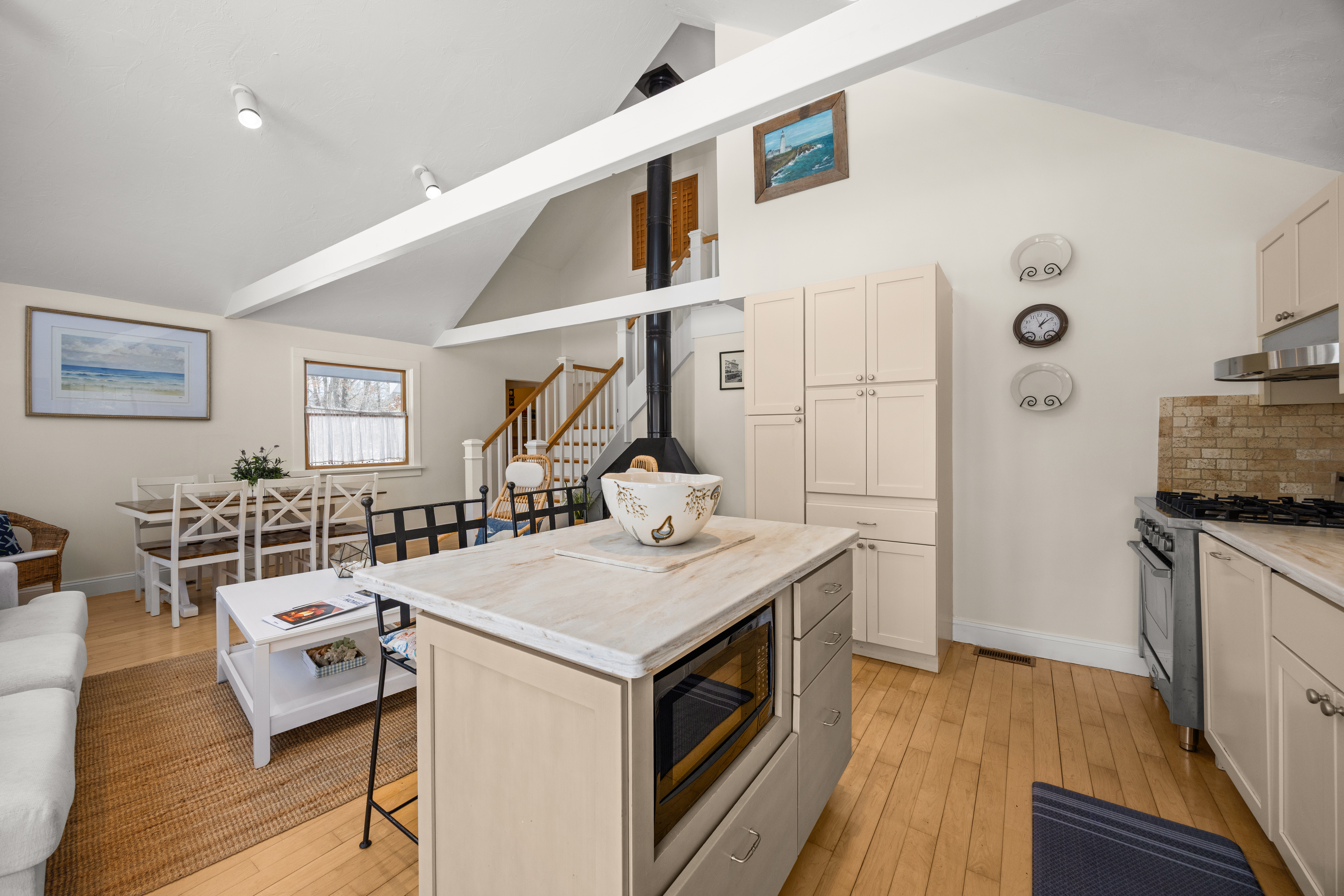 58 Rd To The Plaines Edgartown, MA 02539 - Photo 13 of 40 a open kitchen with a sink stove and wooden floor