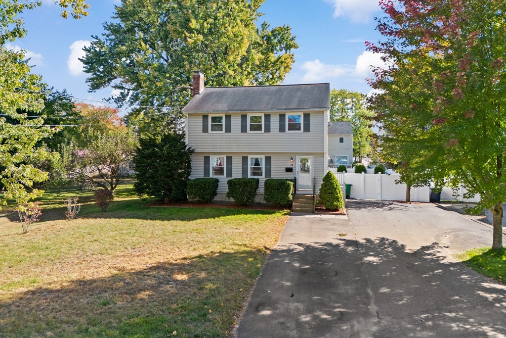 70 Underhill Street Nashua, NH 03060 - Photo 1 of 39 a front view of a house with a yard and trees