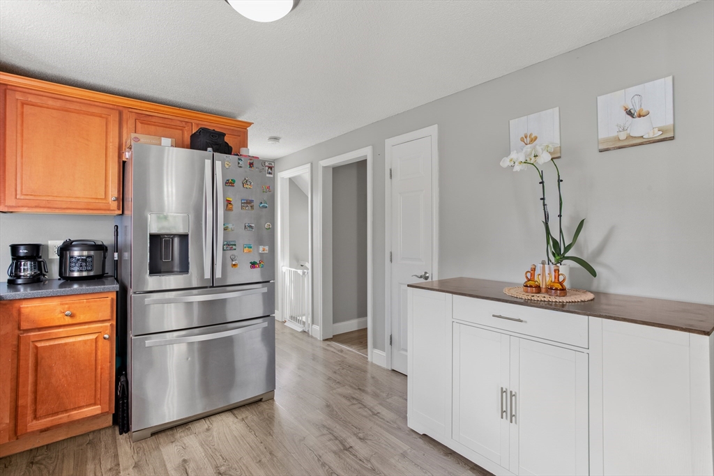 70 Underhill Street Nashua, NH 03060 - Photo 12 of 39 a kitchen with stainless steel appliances a refrigerator and a stove