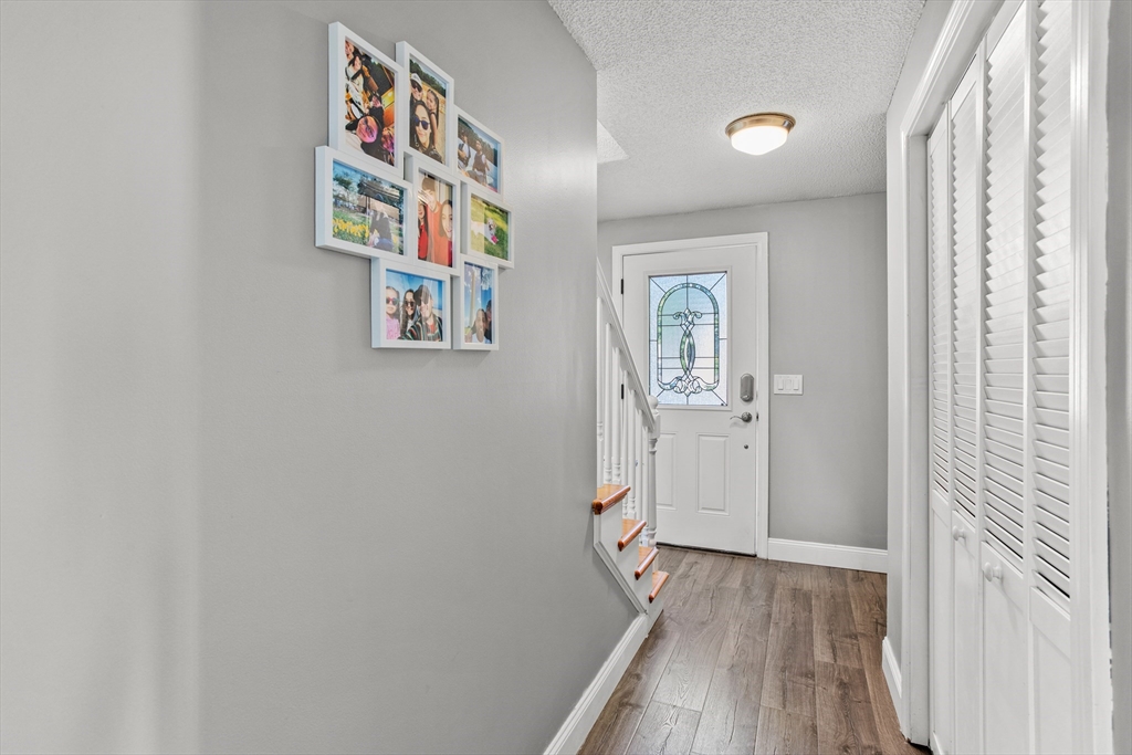 70 Underhill Street Nashua, NH 03060 - Photo 15 of 39 a view of an entryway with wooden floor