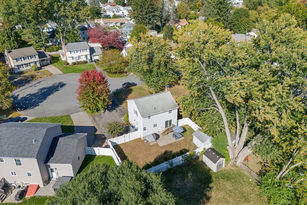 70 Underhill Street Nashua, NH 03060 - Photo 29 of 39 an aerial view of a house with swimming pool and garden