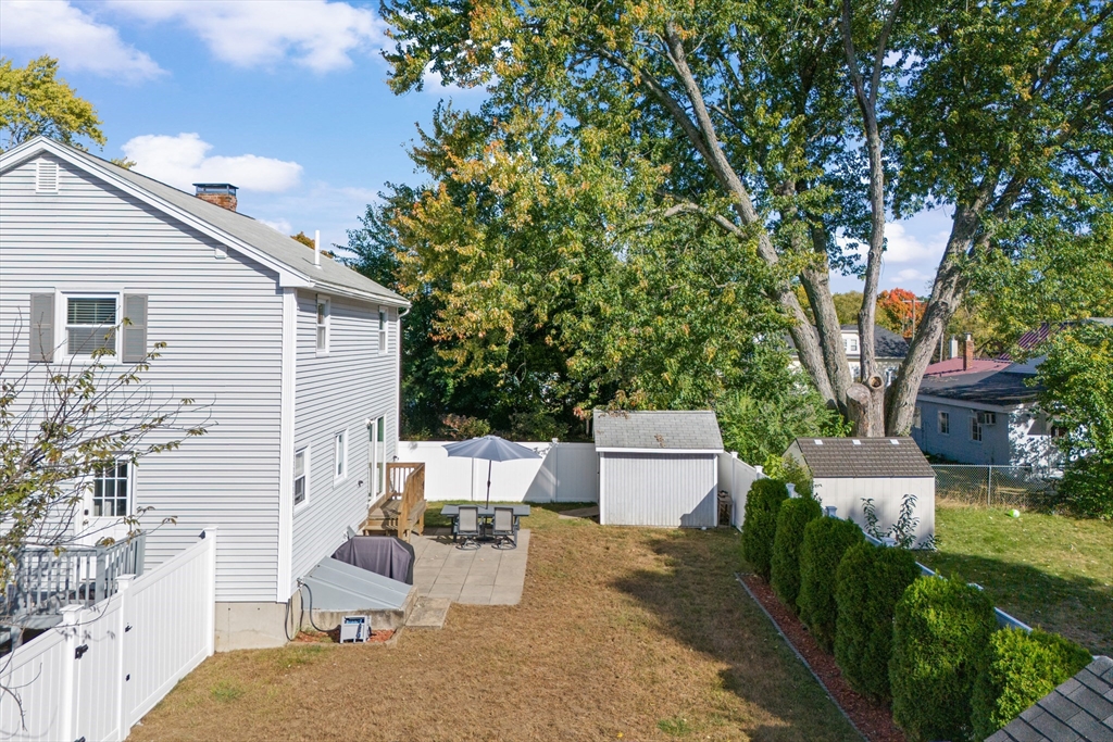 70 Underhill Street Nashua, NH 03060 - Photo 31 of 39 a view of a backyard with sitting area