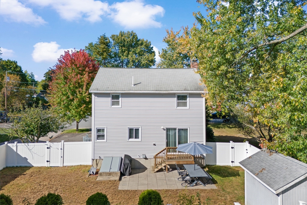70 Underhill Street Nashua, NH 03060 - Photo 33 of 39 an aerial view of a house with yard and trees in the background