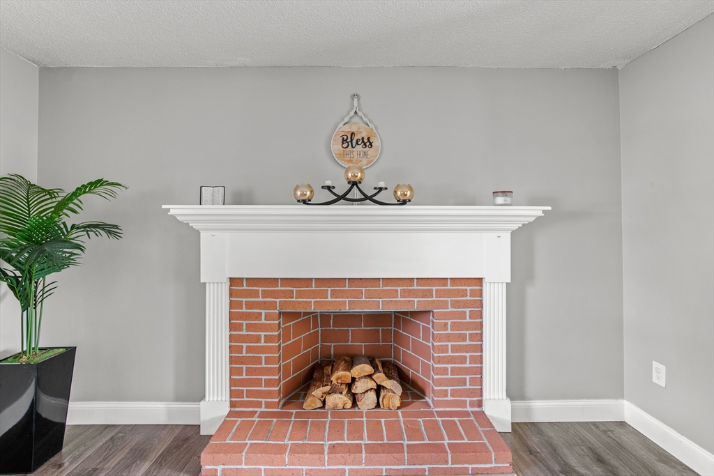70 Underhill Street Nashua, NH 03060 - Photo 4 of 39 a close view of a fireplace in wooden floor