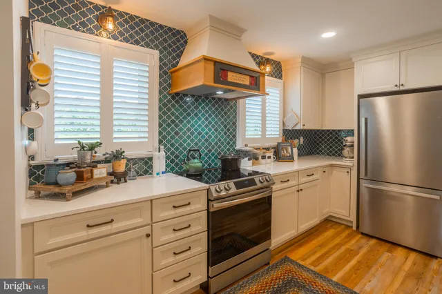 a kitchen with a refrigerator stove and sink