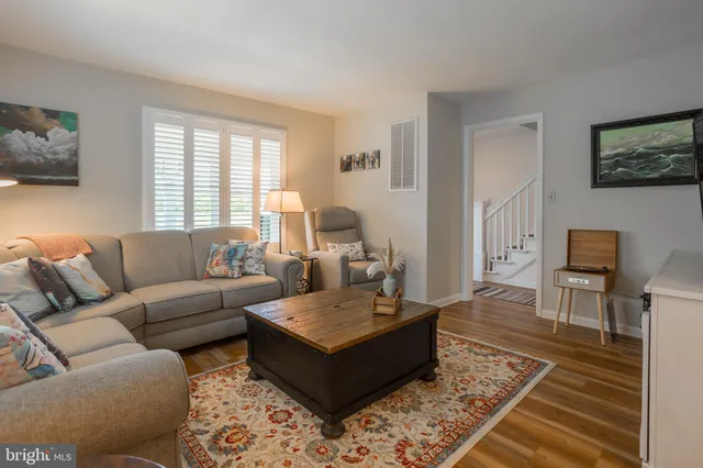 a living room with furniture and a rug