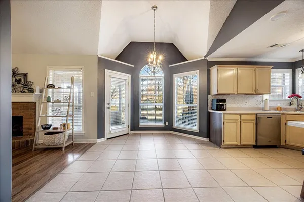 a view of a kitchen with a sink and dishwasher cabinets