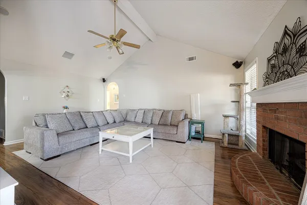 a living room with furniture and a fireplace