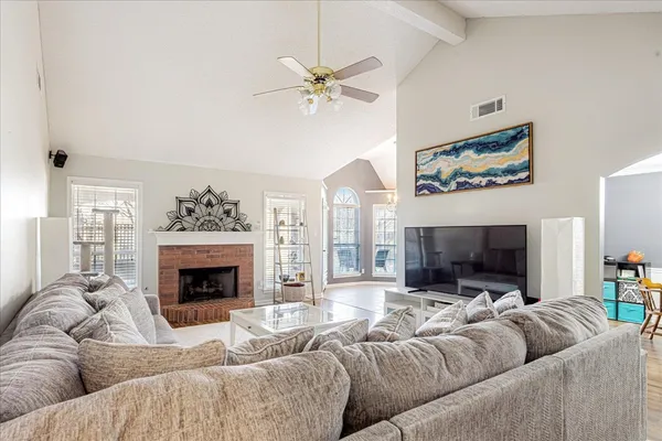 a living room with furniture and a fireplace