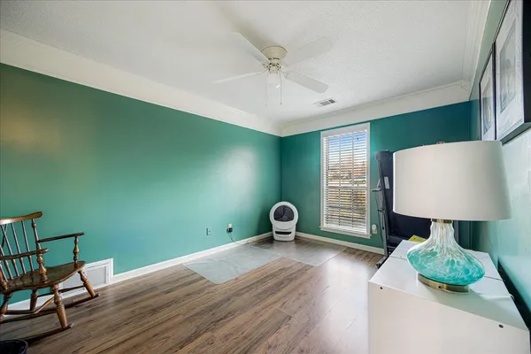 a bedroom with furniture and a bed