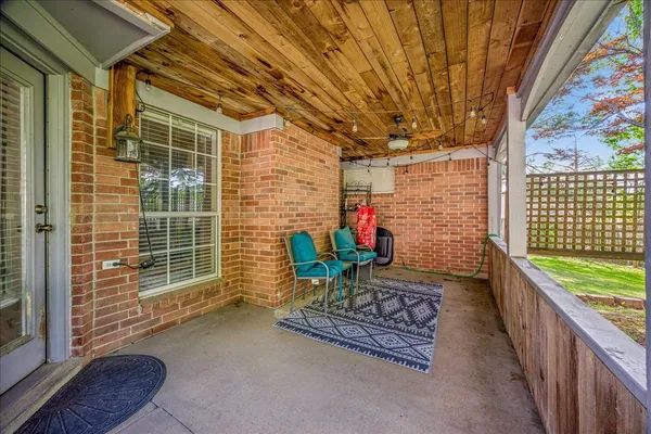 a front view of a house with a yard table and chairs