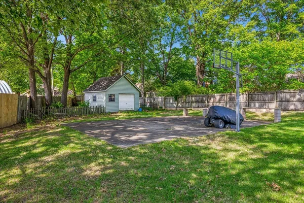 a fire hydrant in the middle of a yard