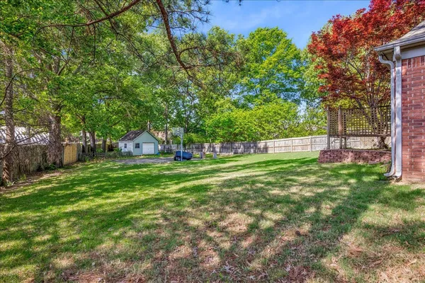 a view of a garden with a bench