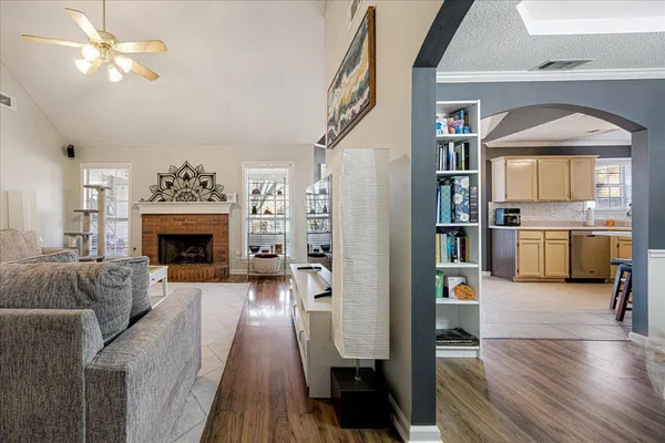 a living room with furniture and a fireplace