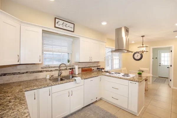 a very nice looking dining room with a table and chairs