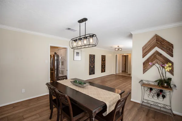 a view of work space with wooden floor and furniture