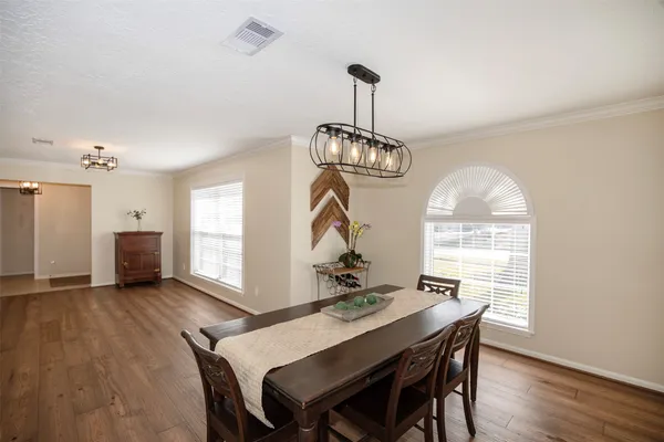 a view of a livingroom with wooden floor and a window