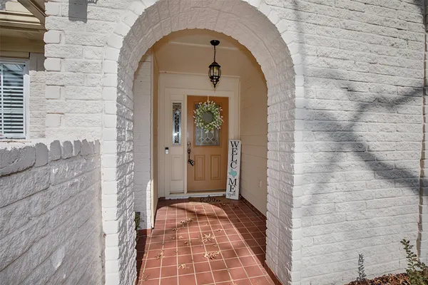 a view of a brick house with a door