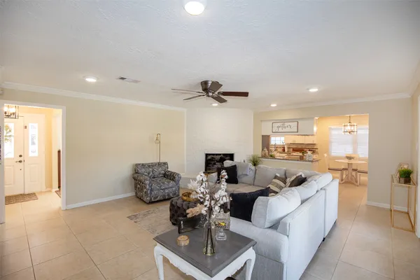 a kitchen with stainless steel appliances kitchen island granite countertop a sink and cabinets